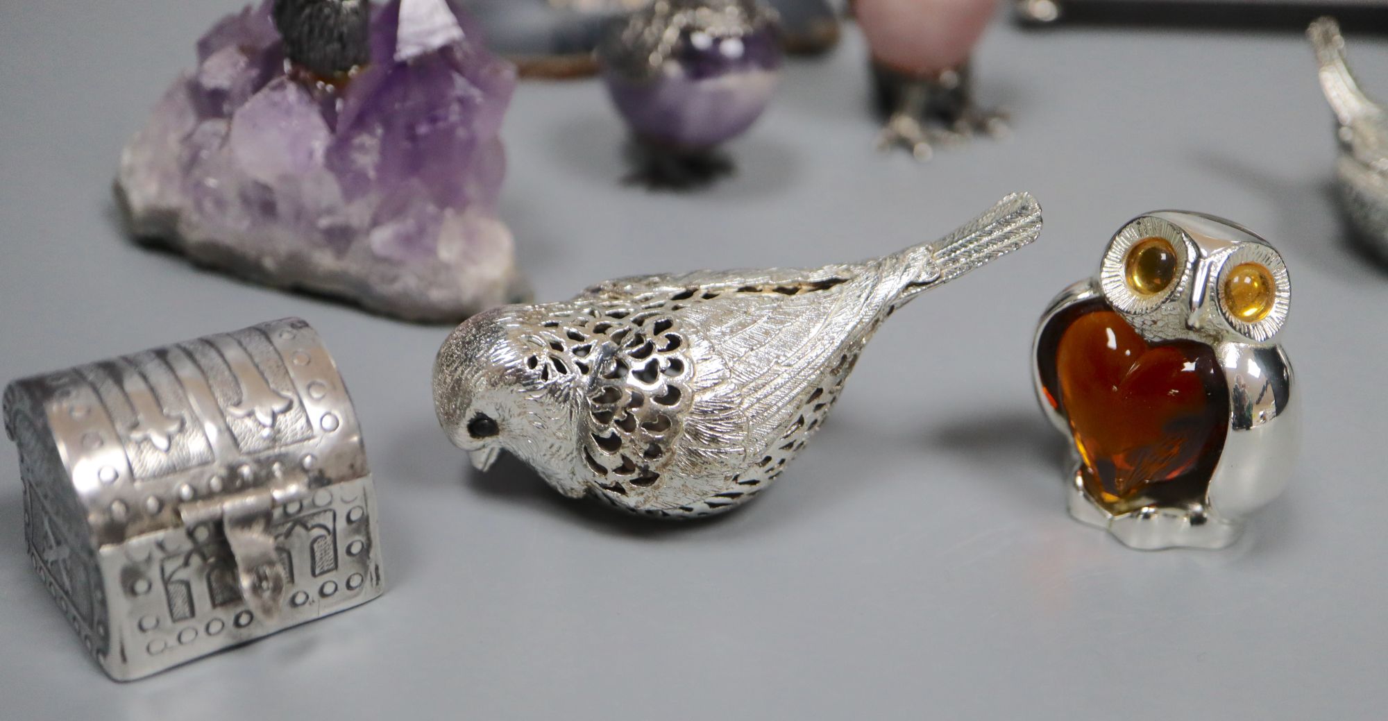A group of small silver, plated and white metal items
